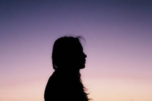 silhouette of woman - profile - during dusk - signs of opioid addiction