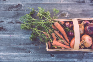 basket of freshly picked carrots and onions - food and nutrition