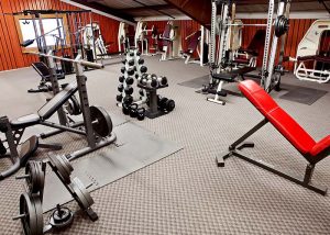 indoor weight lifting gym with free weights and machines