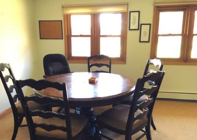 well lit room with round table and chairs - St. Gregory Recovery Center - drug and alcohol rehab in Iowa