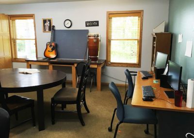 room with computers, guitar, and card table - St. Gregory Recovery Center - Iowa drug and alcohol treatment center