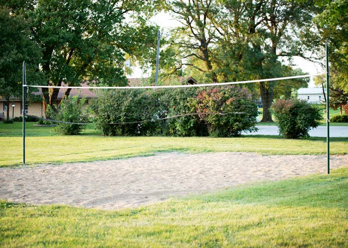 volleyball net and sand court outdoors - St. Gregory Recovery Center - Iowa substance use disorder treatment center